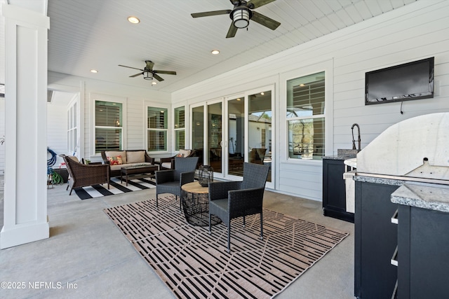 view of patio / terrace with outdoor lounge area and a ceiling fan