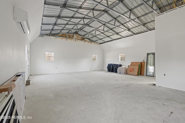 garage featuring metal wall and a wall mounted AC