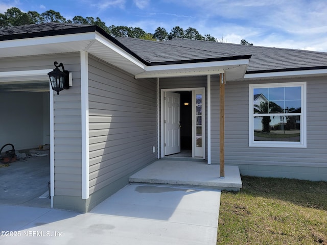 property entrance with roof with shingles