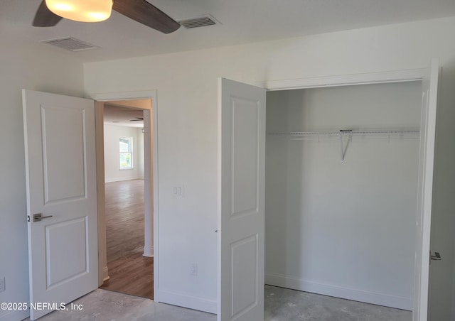 unfurnished bedroom with a closet, visible vents, ceiling fan, and baseboards