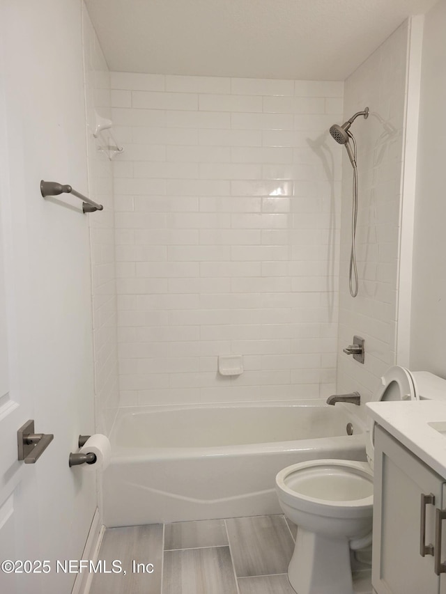full bath with vanity, toilet, and washtub / shower combination