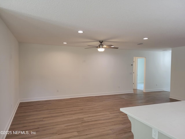 54356 Jamie Dr, Callahan, FL 32011 - unfurnished room with wood finished floors, ceiling fan, recessed lighting, and baseboards