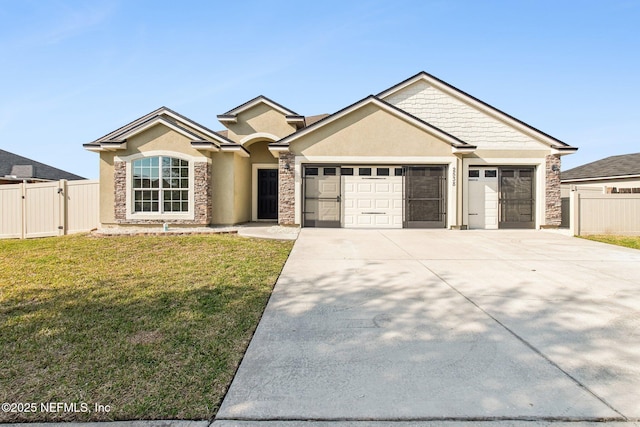 view of front of house with driveway, stone siding, an attached garage, a front lawn, and stucco siding