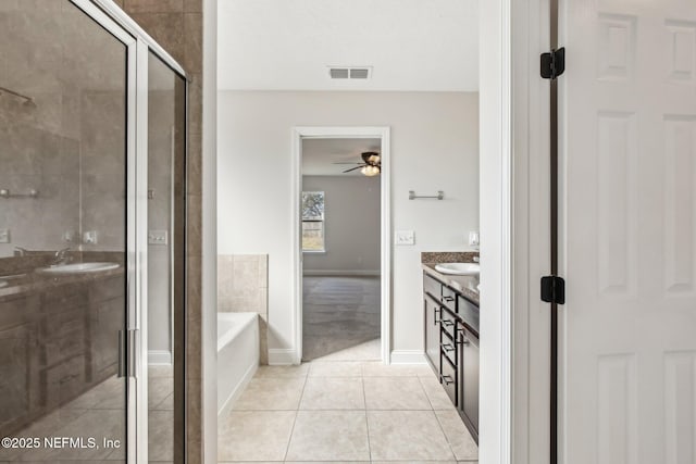 bathroom featuring a garden tub, visible vents, a shower stall, vanity, and tile patterned floors