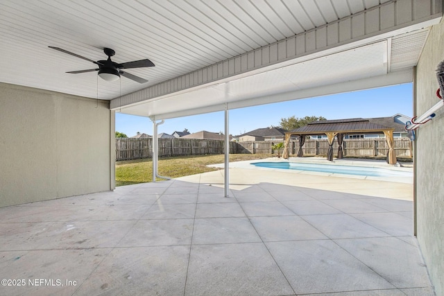 exterior space featuring a ceiling fan