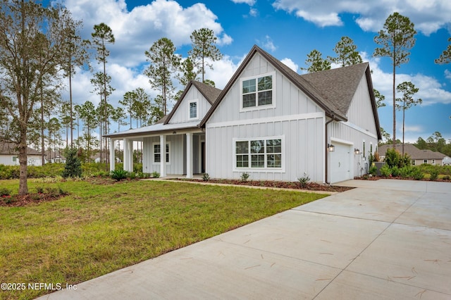 modern farmhouse style home with a shingled roof, concrete driveway, covered porch, a front lawn, and board and batten siding