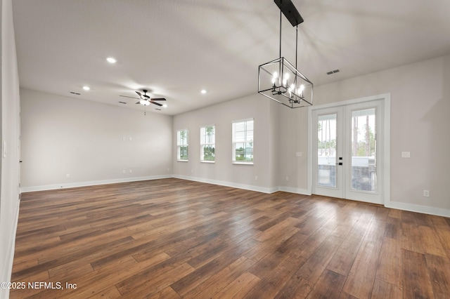 spare room featuring dark wood-style floors, french doors, recessed lighting, and baseboards