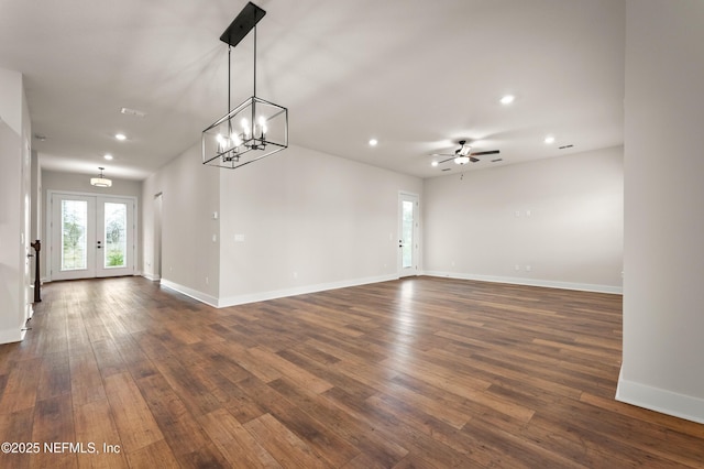 unfurnished room with recessed lighting, dark wood-style flooring, french doors, and baseboards