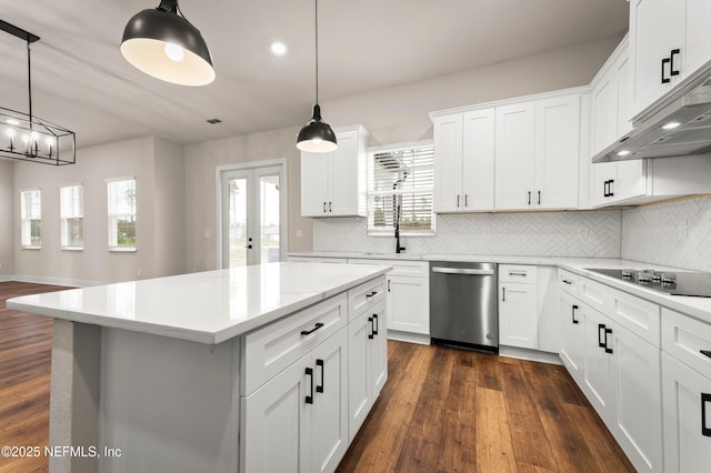 kitchen with under cabinet range hood, dark wood finished floors, black electric cooktop, and dishwasher