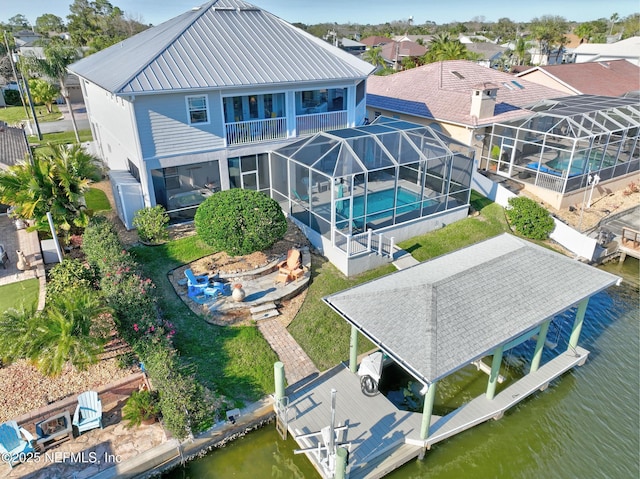 drone / aerial view with a water view and a residential view