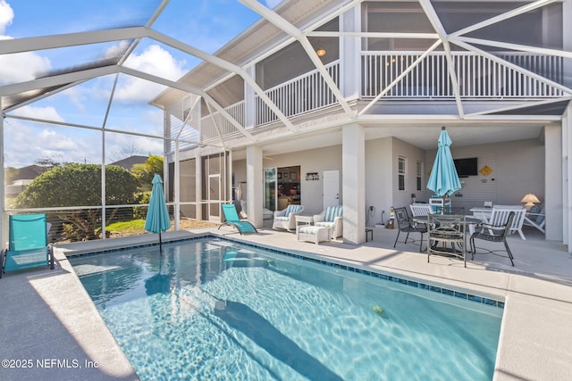 outdoor pool featuring a patio and a lanai