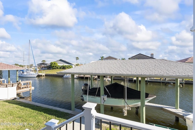 dock area featuring a water view and boat lift