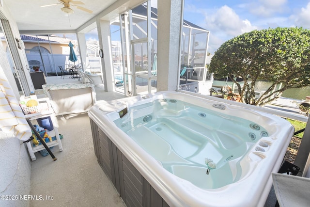 sunroom / solarium with a jacuzzi