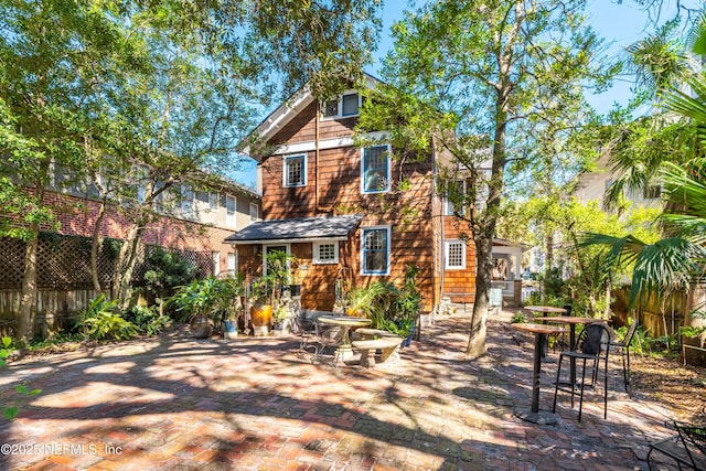 view of front of house with fence