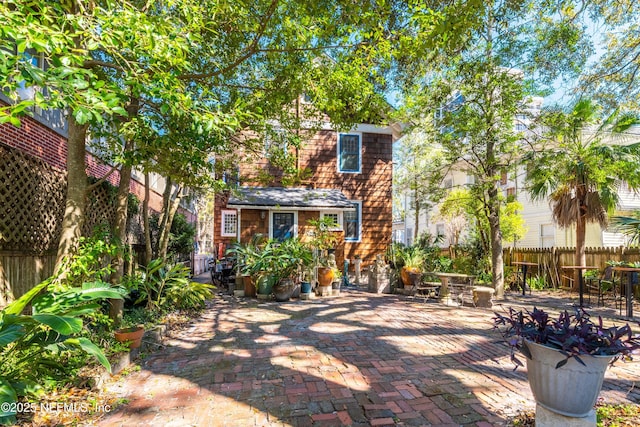 exterior space with a patio area and fence