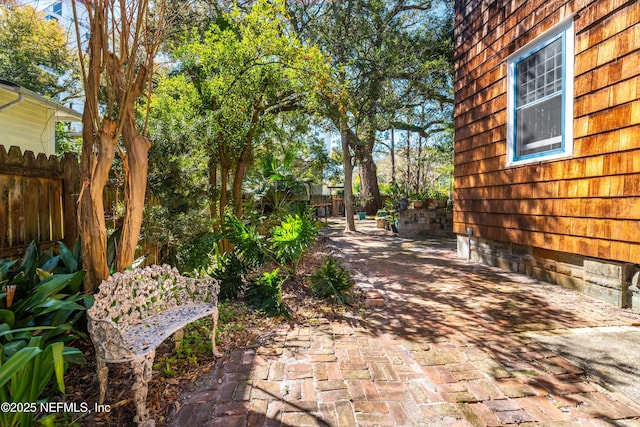 view of patio featuring fence