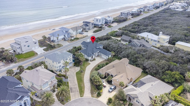 aerial view with a beach view, a residential view, and a water view