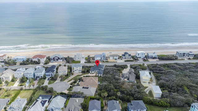 bird's eye view featuring a residential view, a water view, and a beach view