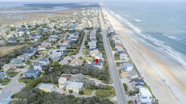 birds eye view of property with a water view, a residential view, and a view of the beach