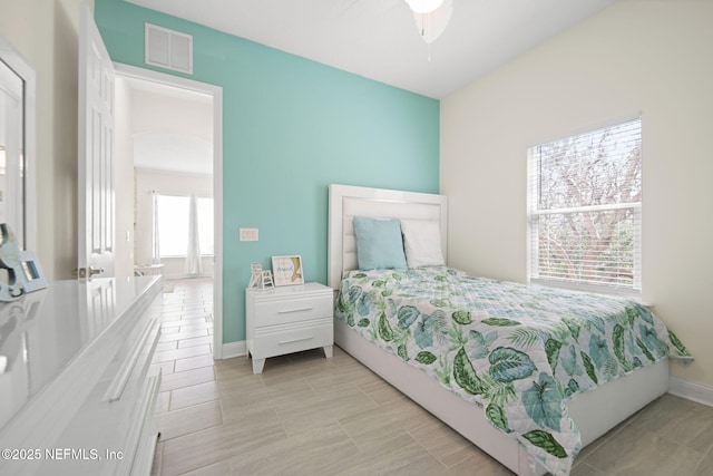 bedroom with visible vents and baseboards