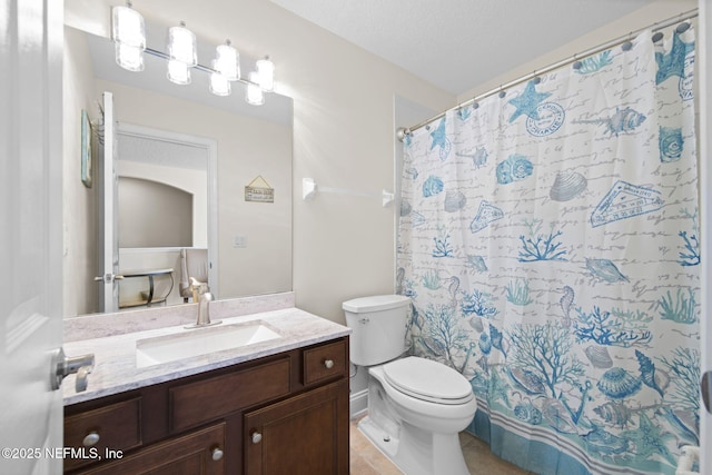 full bath featuring toilet, a shower with curtain, tile patterned floors, a textured ceiling, and vanity