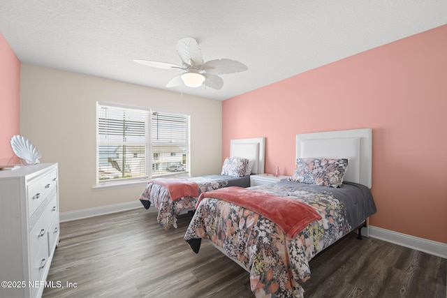 bedroom featuring ceiling fan, baseboards, and wood finished floors