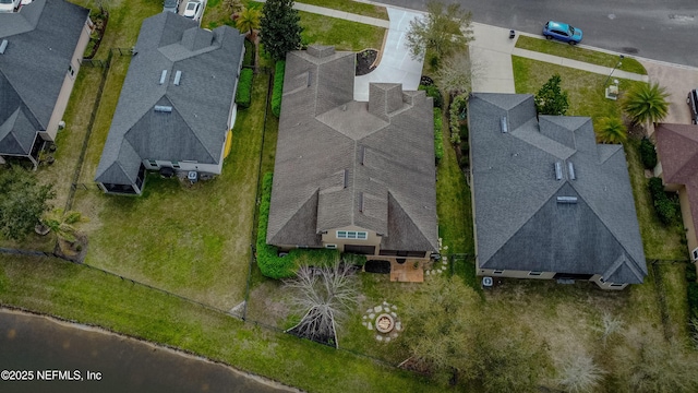 birds eye view of property with a residential view