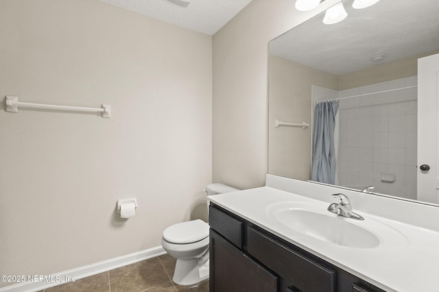 bathroom featuring vanity, baseboards, tile patterned flooring, curtained shower, and toilet