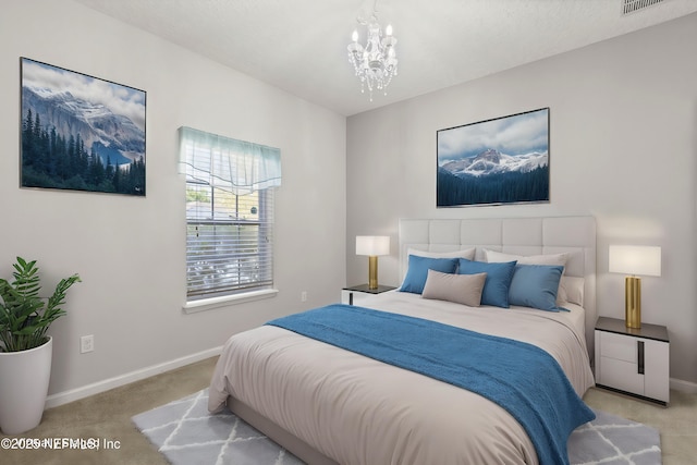 carpeted bedroom with visible vents, baseboards, and a chandelier