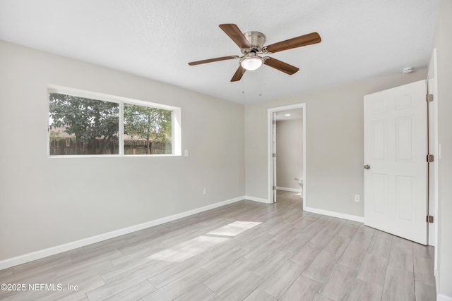 8194 Caravelle Dr, Jacksonville, FL 32244 - unfurnished bedroom featuring light wood-style floors, ceiling fan, a textured ceiling, and baseboards