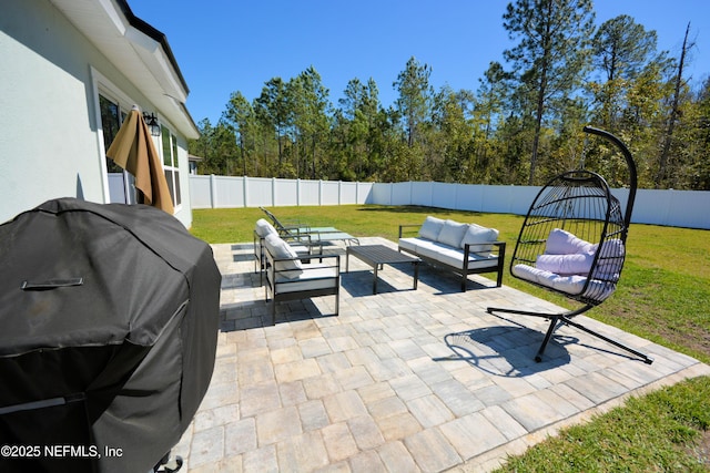 view of patio / terrace with a fenced backyard, a grill, and an outdoor hangout area