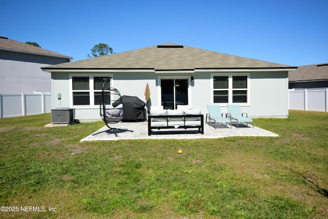 back of house with a fenced backyard, a yard, central air condition unit, a patio area, and an outdoor living space