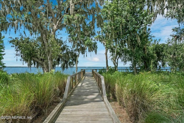 surrounding community featuring a water view