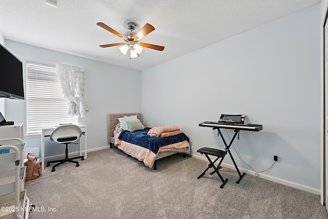 bedroom featuring carpet floors, ceiling fan, baseboards, and a textured ceiling