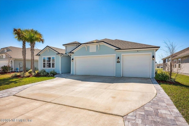 view of front of home with an attached garage and concrete driveway