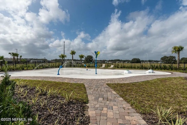 view of community featuring fence