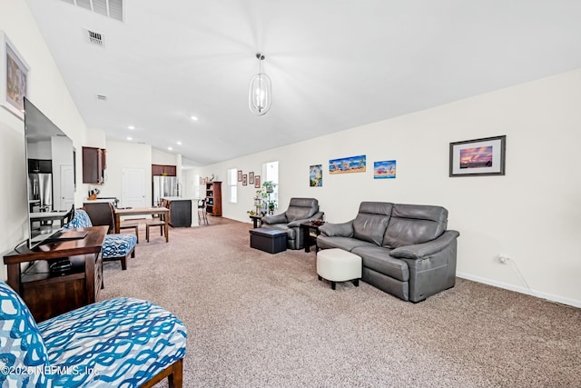 carpeted living area featuring recessed lighting, visible vents, vaulted ceiling, and baseboards