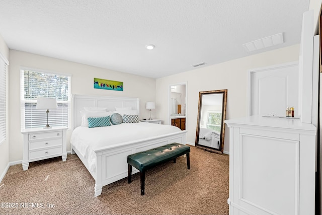 bedroom featuring visible vents, light carpet, baseboards, and a textured ceiling