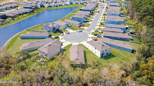 bird's eye view with a water view and a residential view