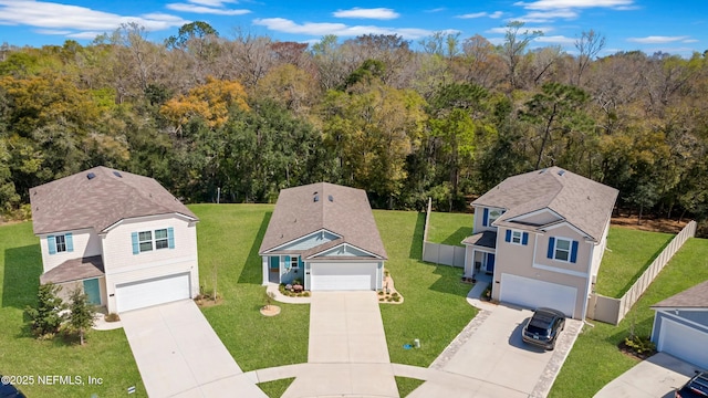 aerial view featuring a wooded view