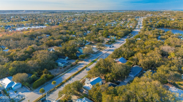 bird's eye view featuring a water view and a wooded view