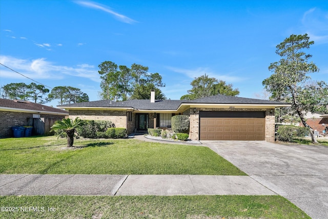 view of front facade featuring a garage, driveway, brick siding, and a front lawn