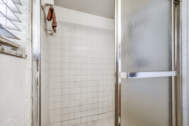 bathroom featuring a stall shower