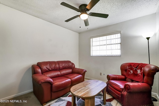 interior space with baseboards, a textured ceiling, and ceiling fan