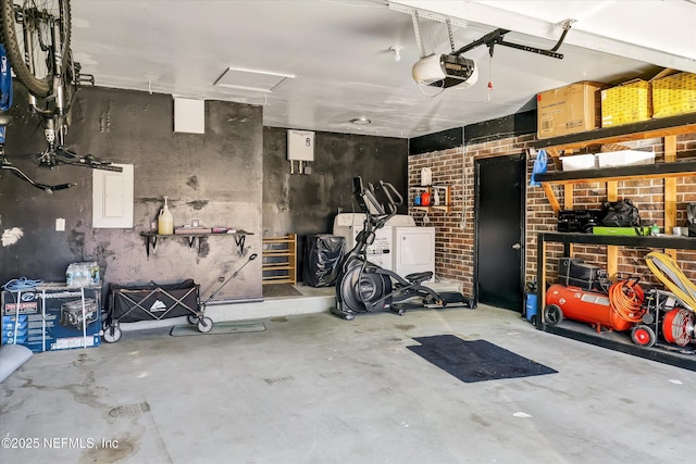 garage with a garage door opener and washer and clothes dryer