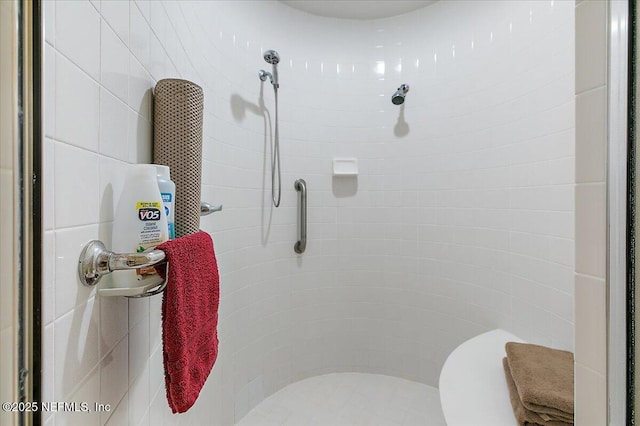 bathroom with tiled shower