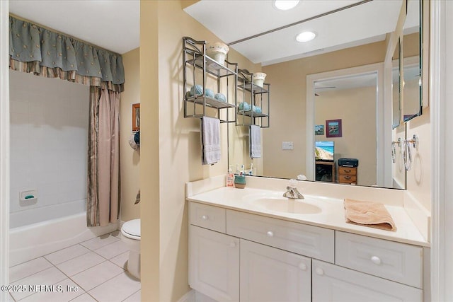 bathroom featuring toilet, tile patterned flooring, shower / bathtub combination with curtain, and vanity