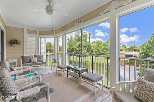 sunroom featuring a ceiling fan