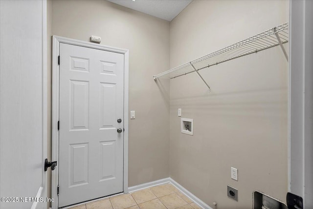 washroom featuring light tile patterned floors, hookup for a washing machine, laundry area, baseboards, and electric dryer hookup