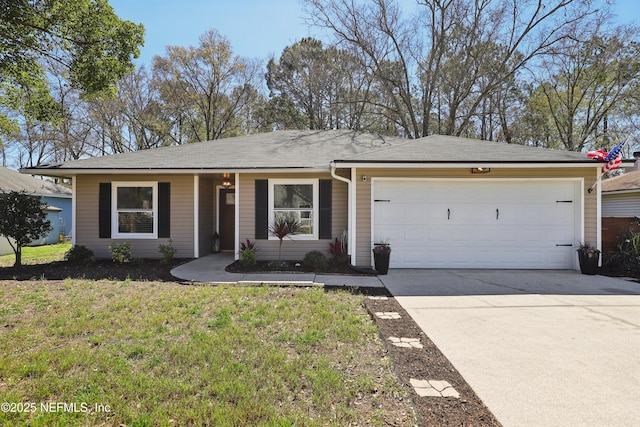 ranch-style home with a garage, a front yard, and driveway